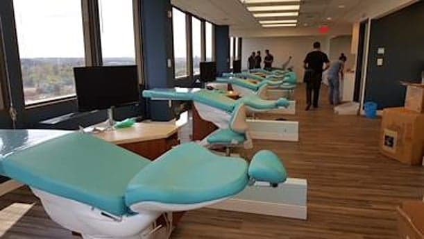 Dental operatory row with cabinetry and flooring