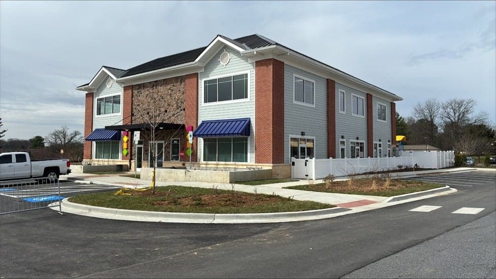 Completed commercial building with stone and brick exterior