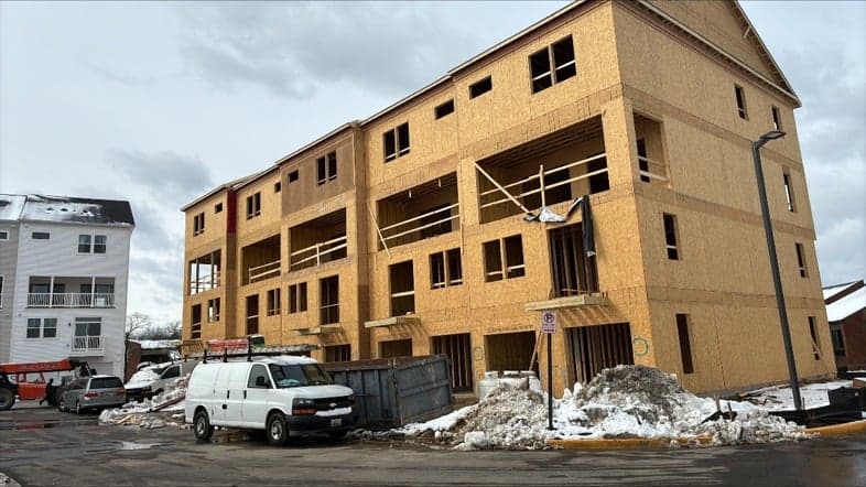 Multi-story residential framing and sheathing under construction
