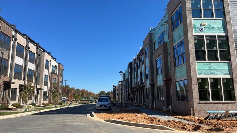Townhome development with brick and weather barrier exterior